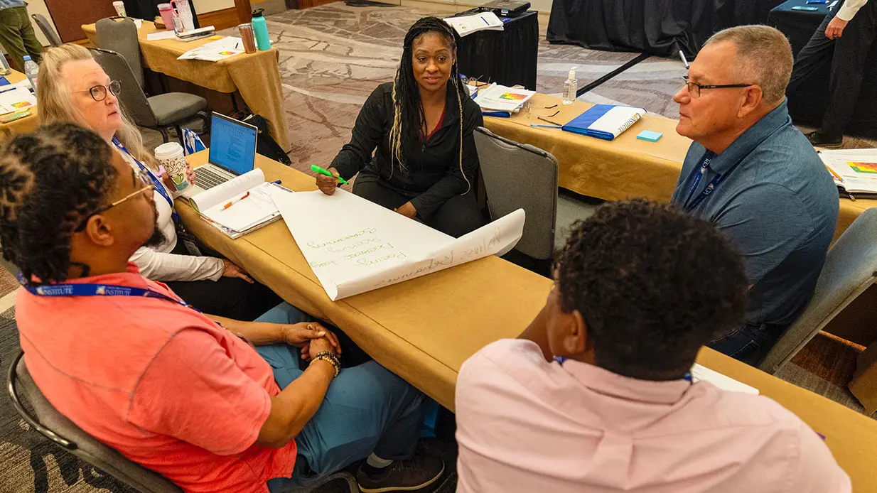A group of people working together during CPI training.