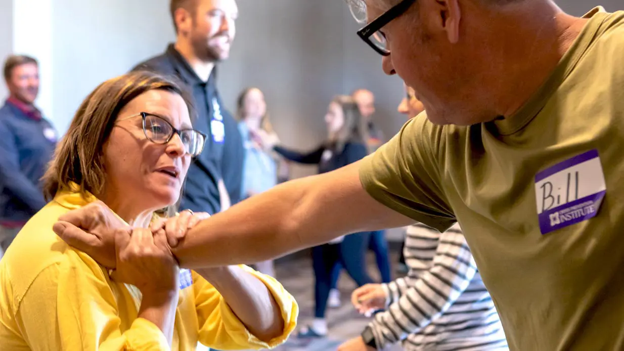 A woman exhibiting a hold during CPI training